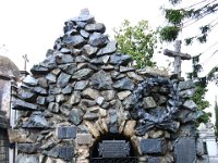 The cross you see is a Masonic cross (crooked).  The cemetary was once on Catholic grounds but due to the economic influence of the current Masonic inhabitants that has been rescinded.